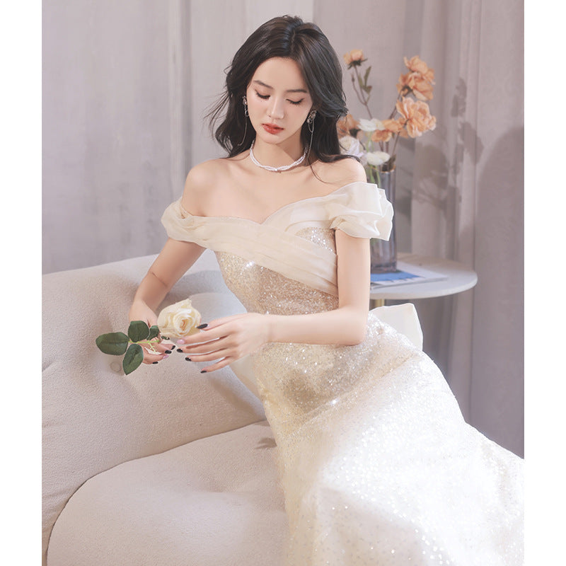 2025 One-word shoulder evening dress skirt  new temperament light luxury niche champagne color super fairy host banquet evening dress