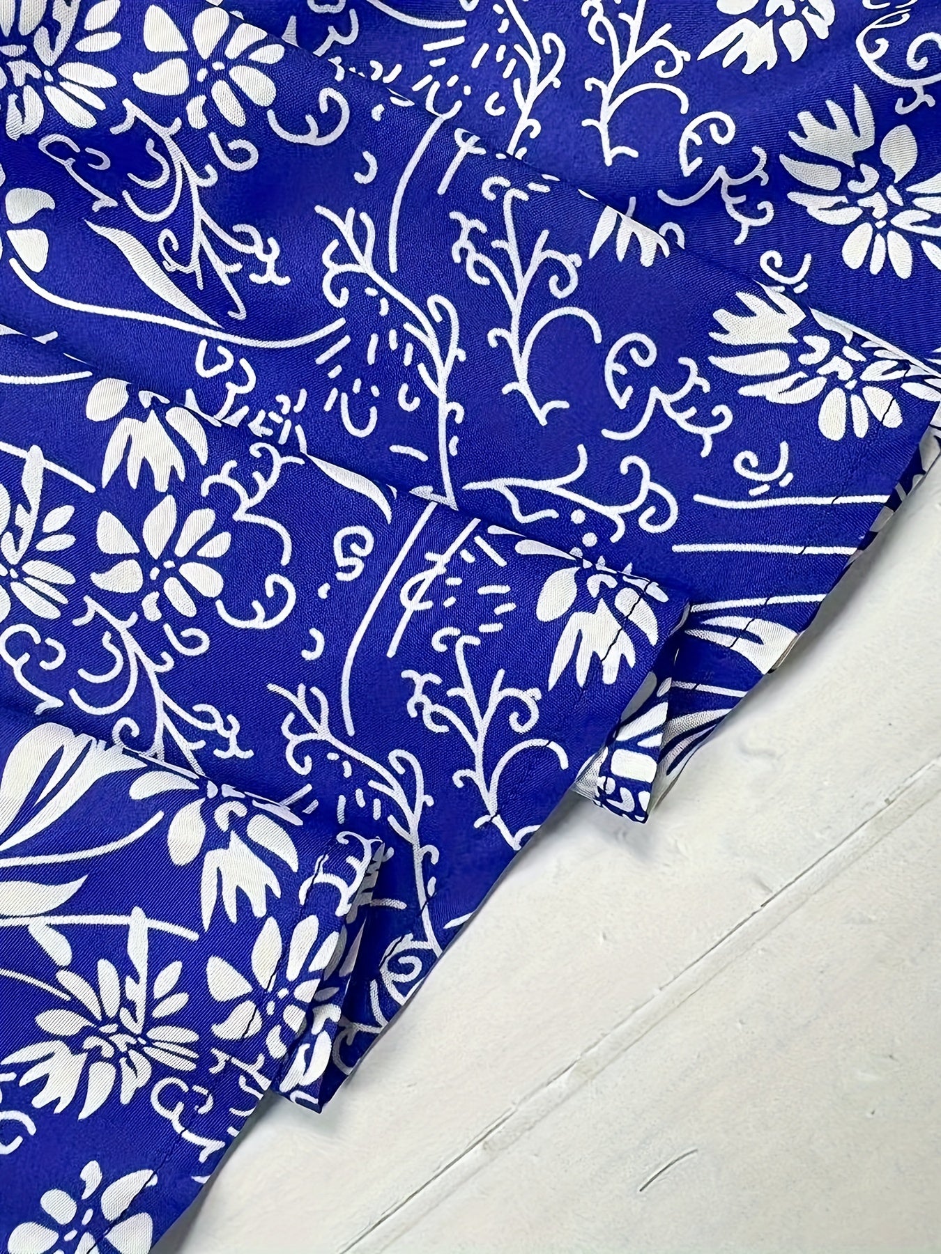 Plus Size Elegant Skirt, Women's Plus Floral Print Knot Front Elastic High Rise Asymmetric Hem Swing Maxi Skirt