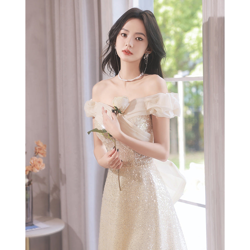 2025 One-word shoulder evening dress skirt  new temperament light luxury niche champagne color super fairy host banquet evening dress