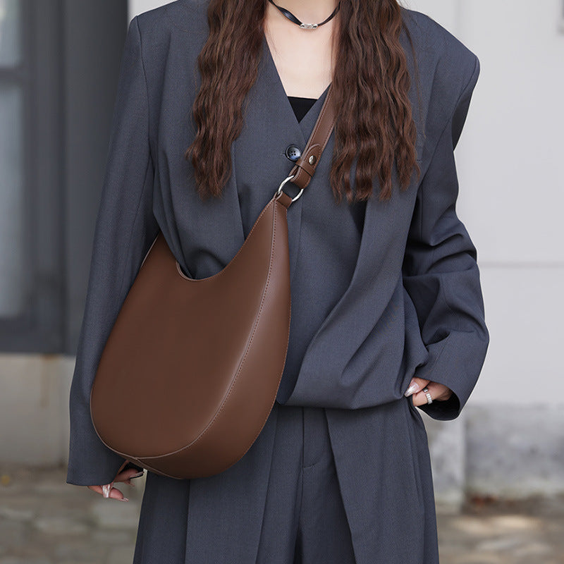 VLOVELAW 2025 popular new niche design special-shaped crescent bag, semi-round bag, one-shoulder underarm women's bag, leather messenger tote bag.